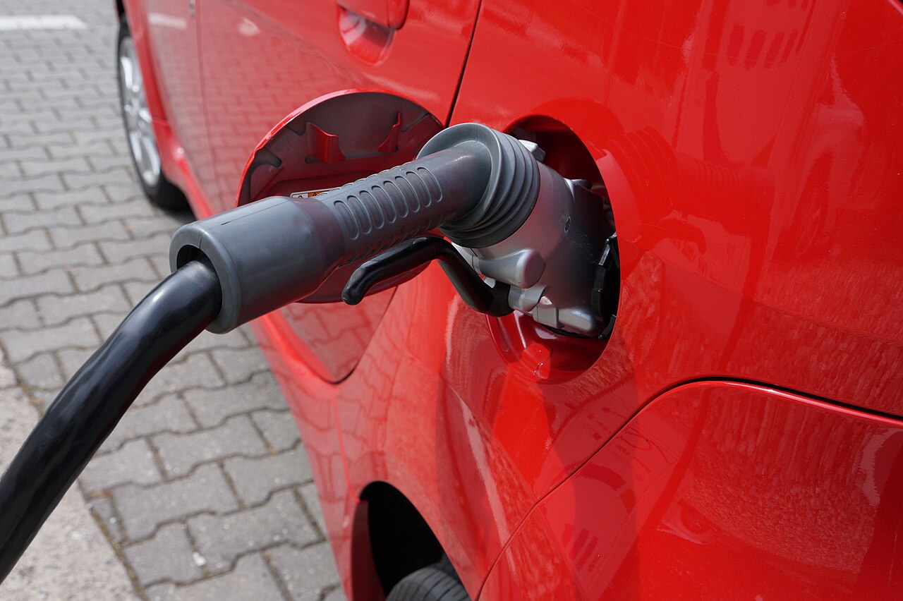 Electric vehicle charging port being serviced