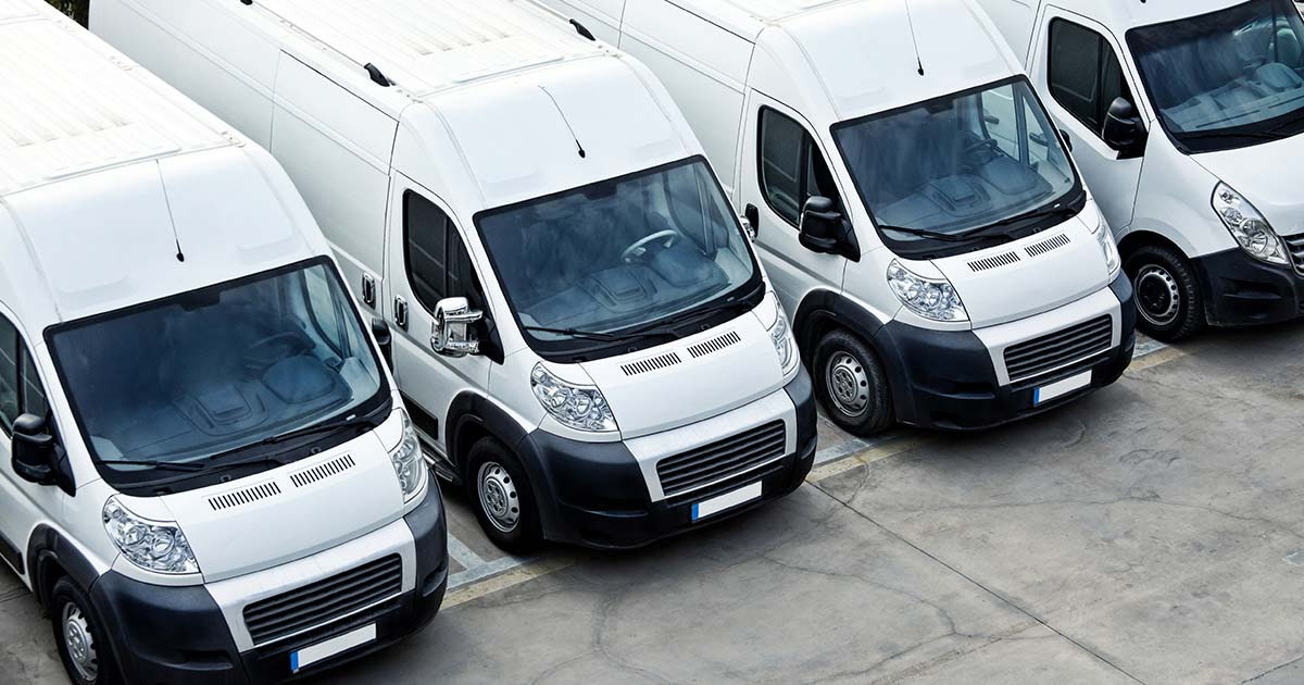 Row of white fleet delivery vans